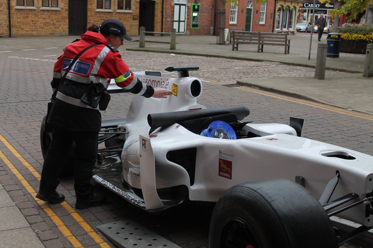 gpracedriver1's tweet photo. Here's a little throwback to the time one of our F1™ Simulators was given a parking ticket!

Fortunately it turned out to just be a good excuse to snap a great photo! https://t.co/Yuc8ZWGIIG