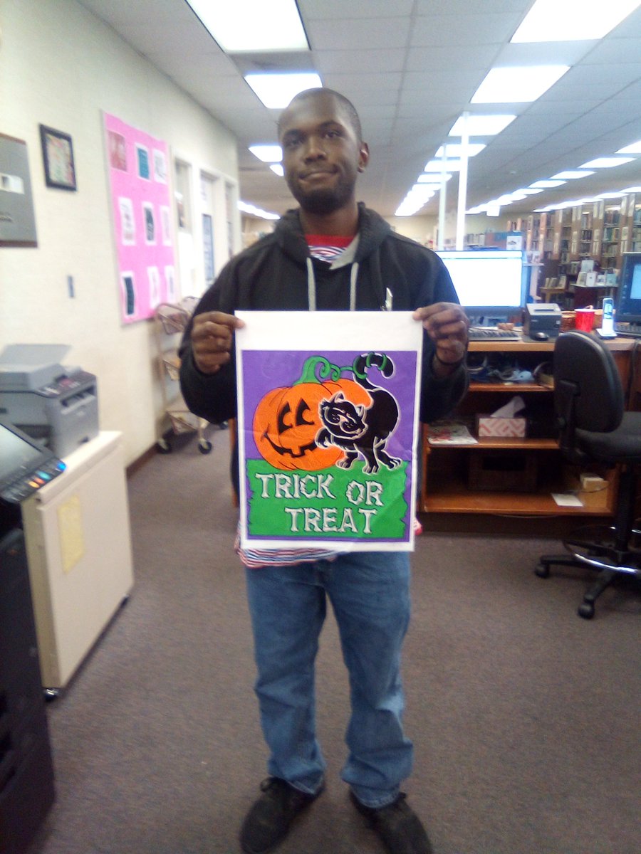 Ryan is showing off one of the Halloween trick or treat bags for sale at the libraries.  Only $1.00 per bag!  Great for trick or treating.