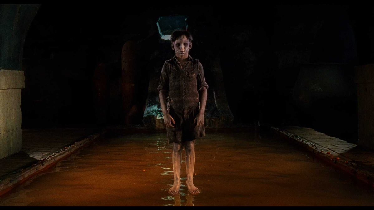 THE DEVIL'S BACKBONE (2001) dir. Guillermo del Toroghost story // 10-year-old Carlos arrives at a school for orphan boys in the midst of a civil war, & slowly begins unraveling the school's secrets—which seem to be connected to a ghost boy wandering the grounds.