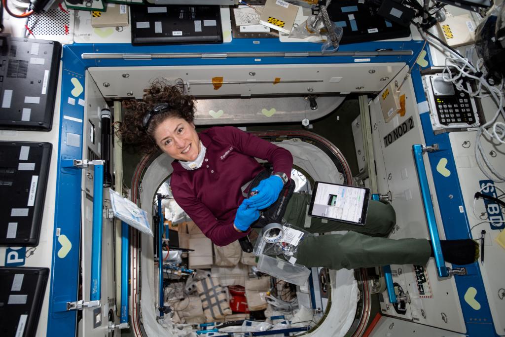 Christina Koch floating on space station