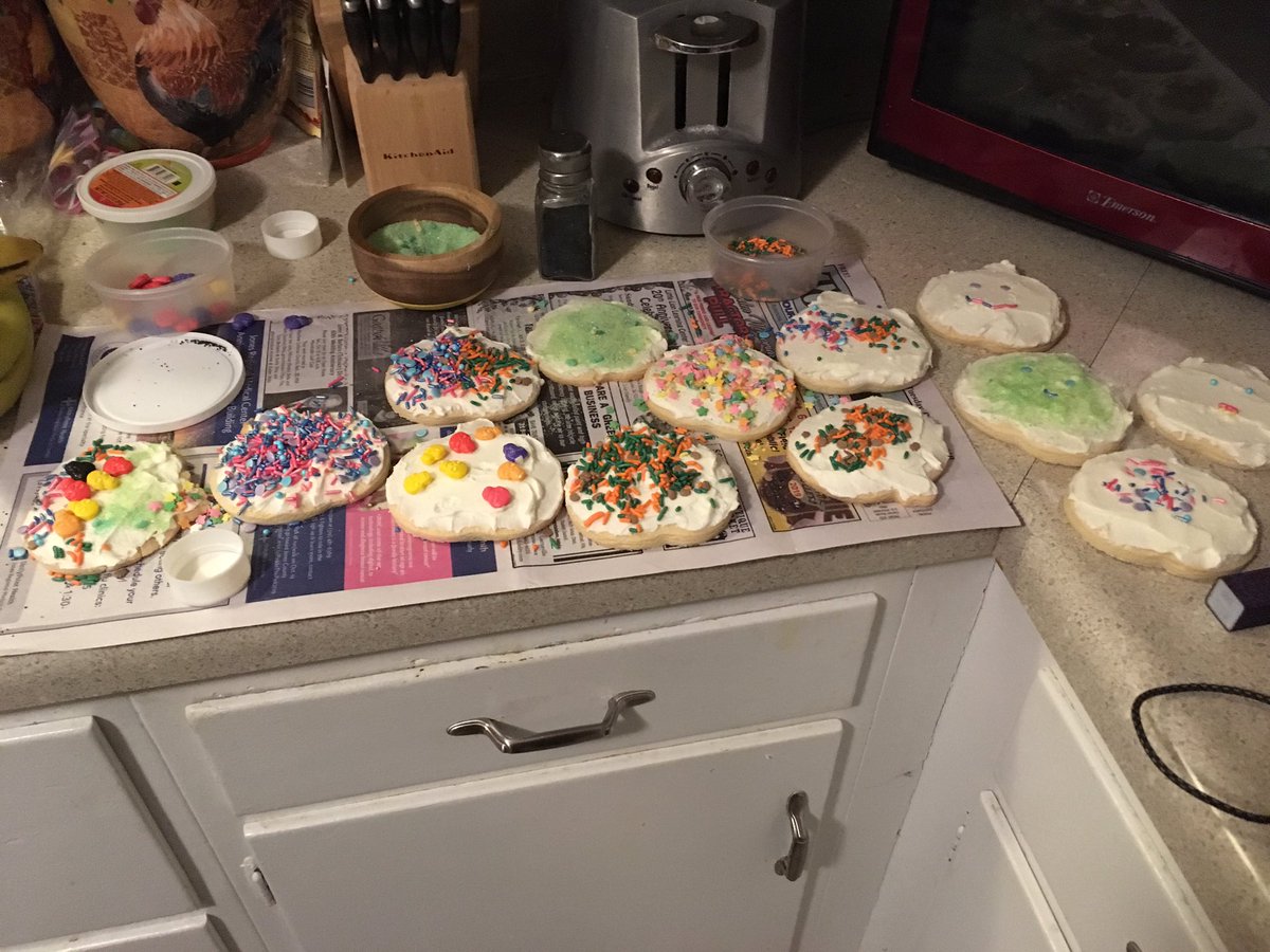 Kids decorating cookies. Last year at Christmas I had a ton of Halloween sprinkles, now I have a ton of Christmas sprinkles 😐