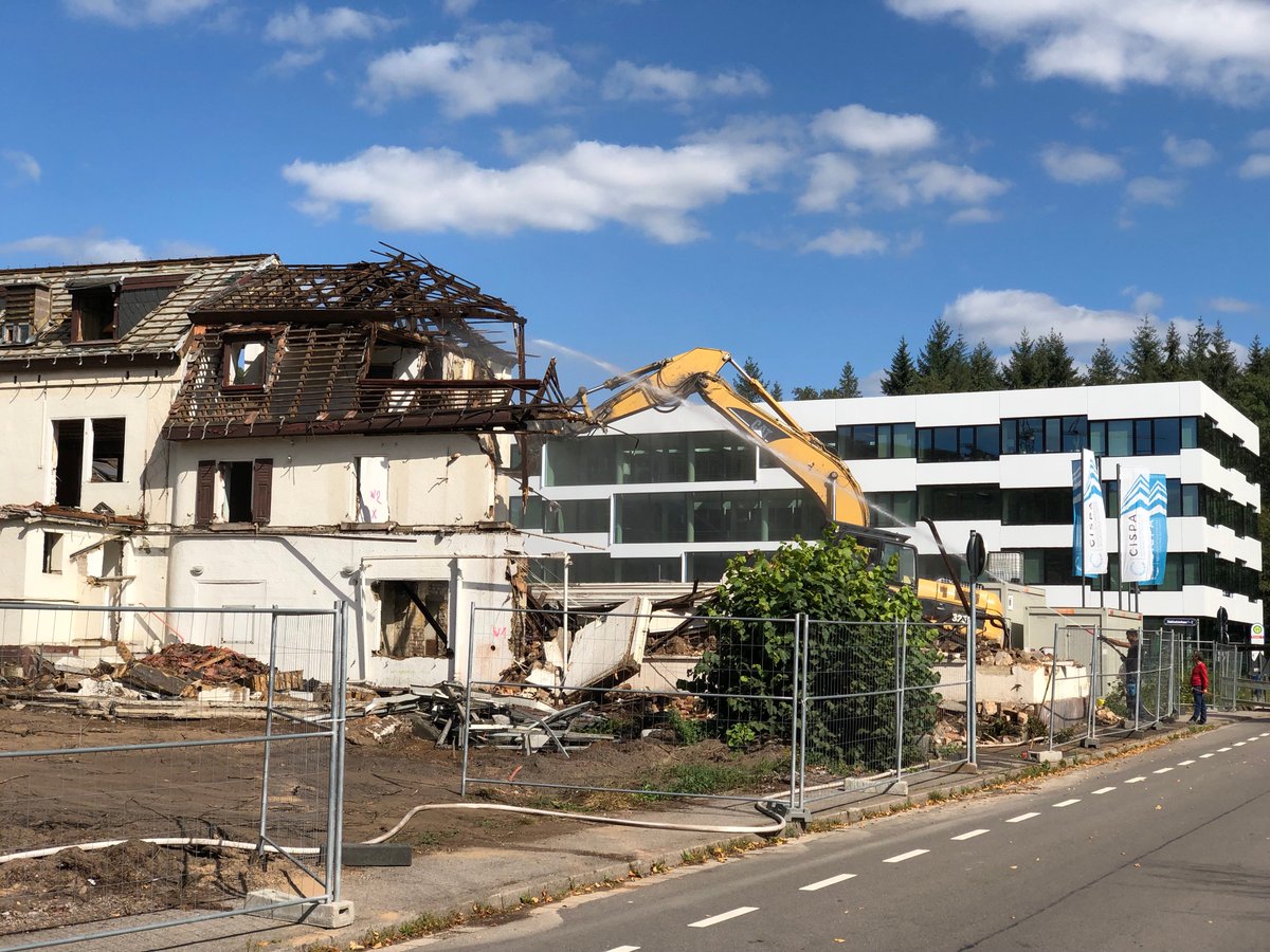 Excavator tearing down Stuhlsatzenhaus