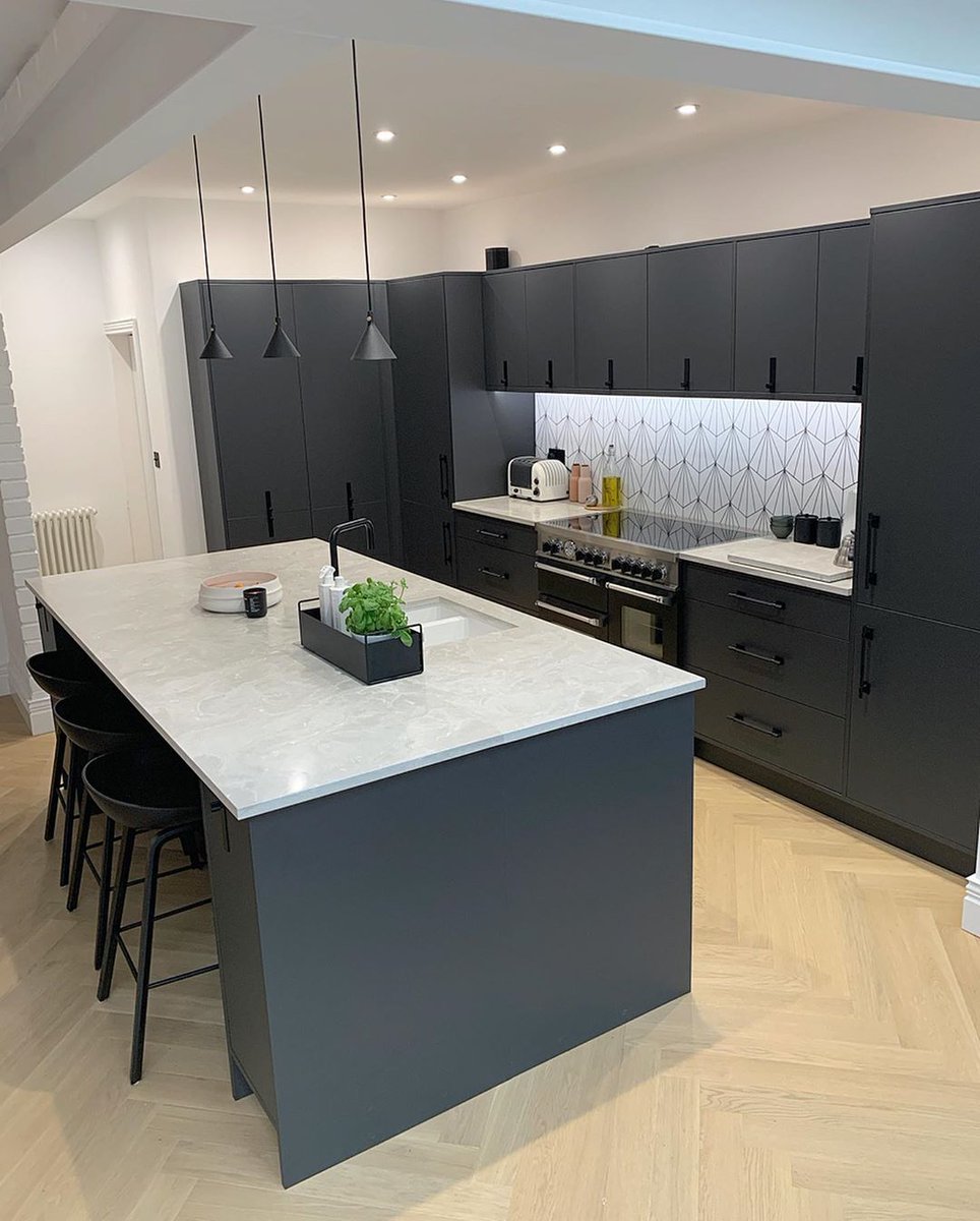 #MISTRALHighlights - Black and grey tones give this kitchen a contemporary look that utilises the impact of contrast beautifully. MISTRAL Moonscape work surfaces are partnered with geometric wallpaper to create an abstract style that's brimming with imaginative swirls and shapes.