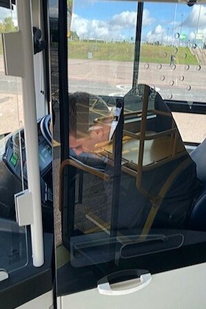TASPartnership's tweet photo. Say hello to Sarah & JP at the #CoachandBusShow today & there only today - TAS consultant John Porter in the proverbial driving seat, while Sarah Huntley, our MD, takes the picture! Grab them over lunch, talk transport+more & enjoy the Show! #SunShiningAtCoachandBusShow☀️ https://t.co/AnnmrqkGDT