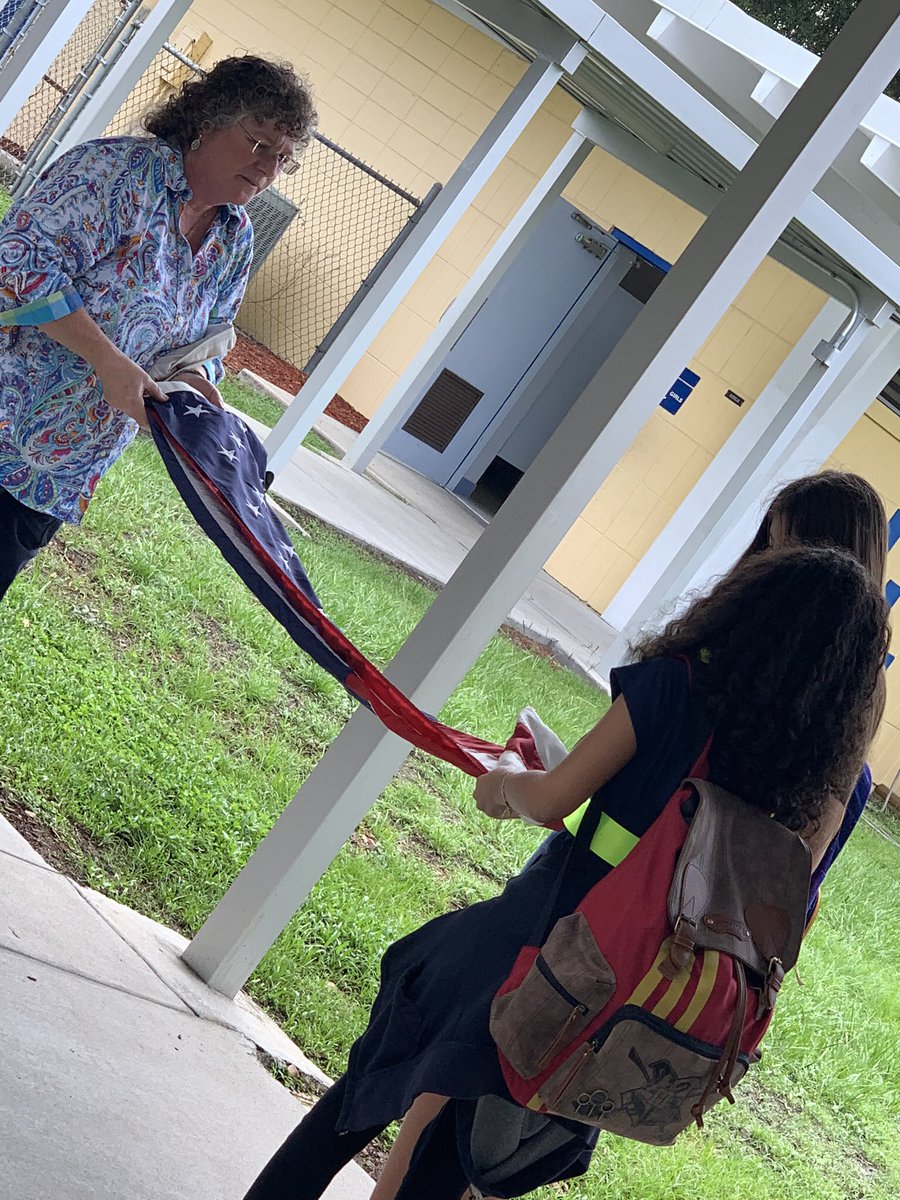 HCPSClairMel's tweet photo. Our safety patrol sponsor, Ms. Terle, teaches our newly inducted safety patrols how to properly fold the American flag. @AchievementSch @HillsboroughSch https://t.co/tNx3r5DKZA