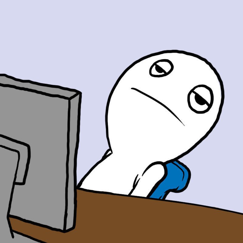 Computer reaction meme at desk looking back with exhausted distain.