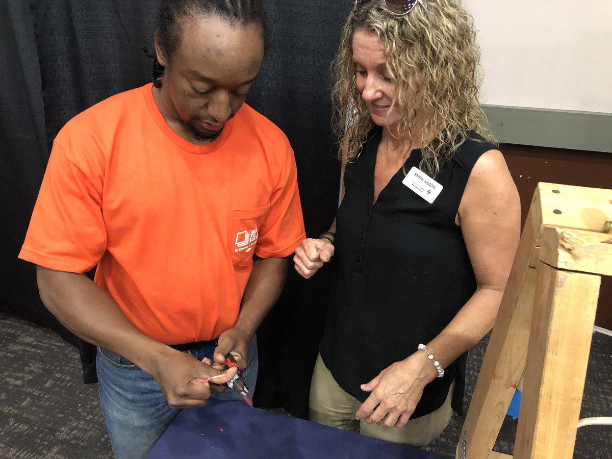 INConstCareers's tweet image. Day two of @Jaswin1964 #JAJobSpark in Evansville. We caught one of our second year electrical apprentices teaching the @AGCofIndiana Southwest Coordinator, Krista Wilson, how to strip wires.  Knowledge is a powerful tool! #builttosucceed