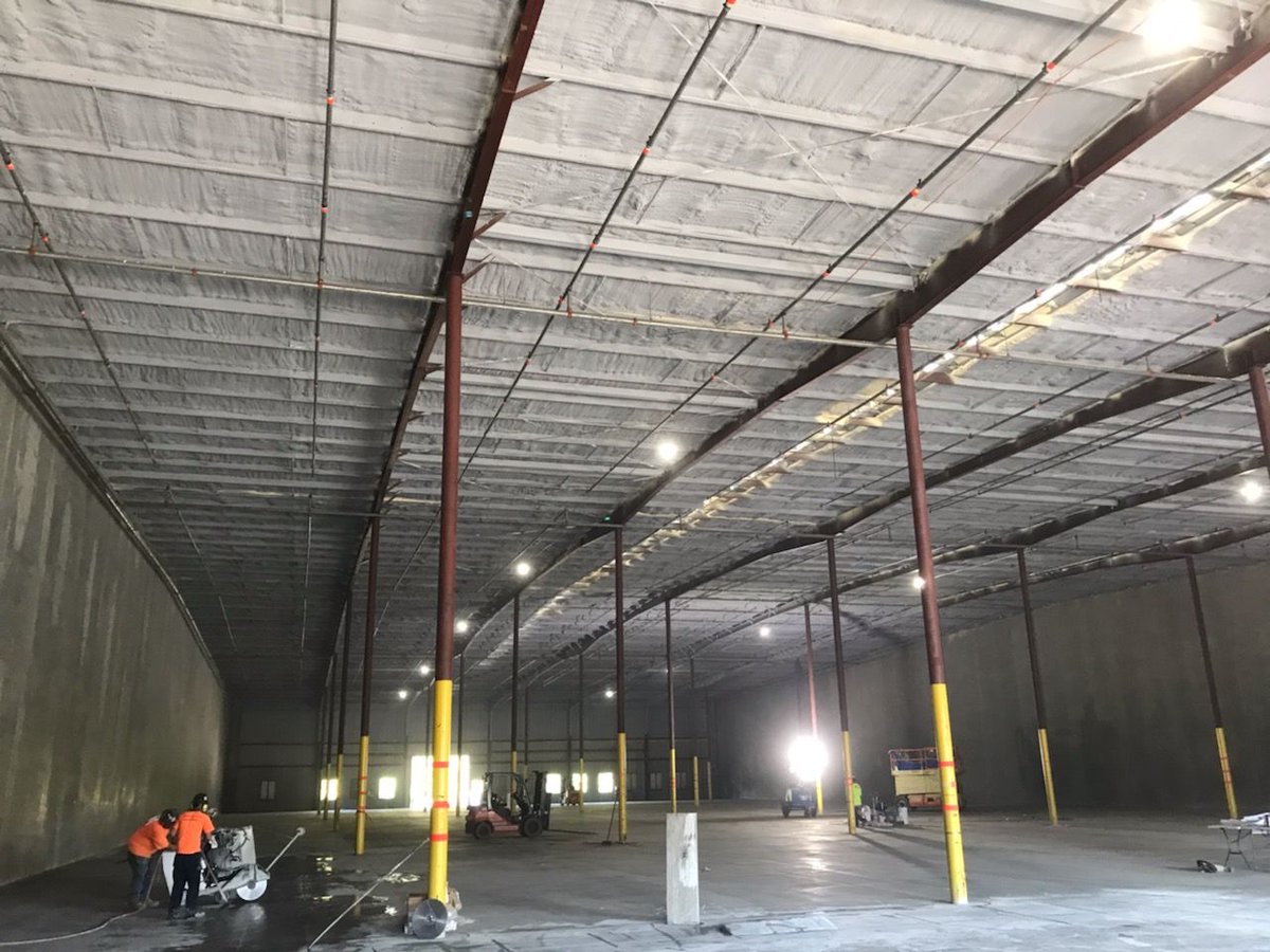 EnergyOneFoam's tweet photo. #Sprayfoam #insulation enabled adaptive reuse of this NC #warehouse to keep their future massive amounts of inventory protected from moisture &amp; air pollutants. Today's task? 10,000 sq ft of 3.5" #closedcell in the roof deck. It's go time for our crews!
#commercial #construction https://t.co/sw0hRriujm