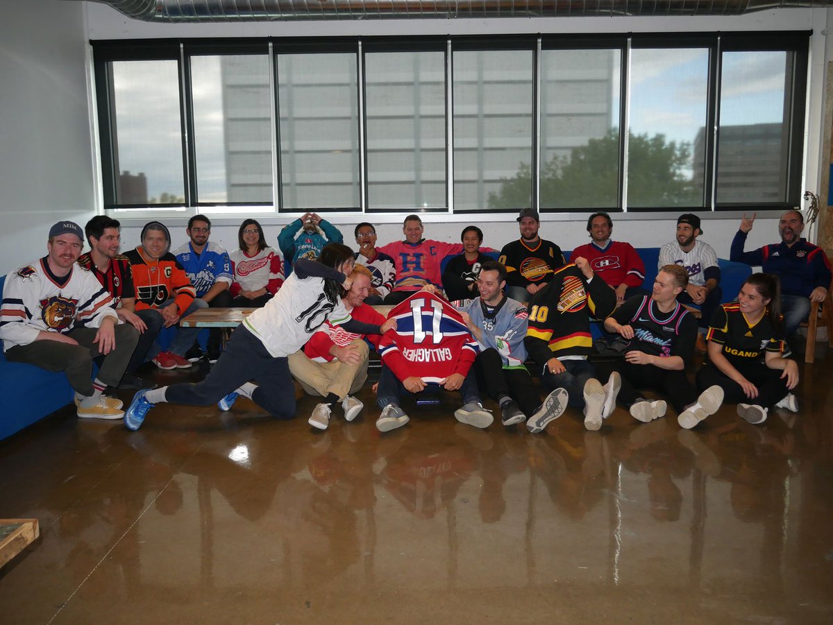 Sportlogiq's tweet photo. To celebrate the start of the NHL season, we had a "Jersey Day" at Sportlogiq. The goal was to get everybody to wear their most unique jersey (from any sport). Here's a look, see any that stand out? https://t.co/7tksfFZCti