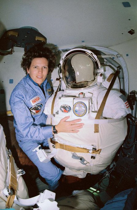 STS-31 Mission Specialist Kathryn D. Sullivan poses for a picture before donning her space suit and extravehicular mobility unit in the airlock of Space Shuttle Discovery.