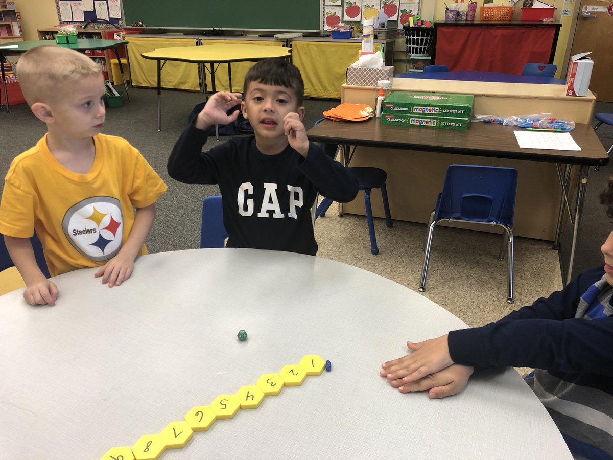 k5mathgcdisney's tweet photo. Kindergarteners sharpening up their 1:1 correspondence and count sequence by moving some baby worms down the hexagon sidewalk. Fun on a rainy day. #wds1819 https://t.co/WdpA4IkZyA