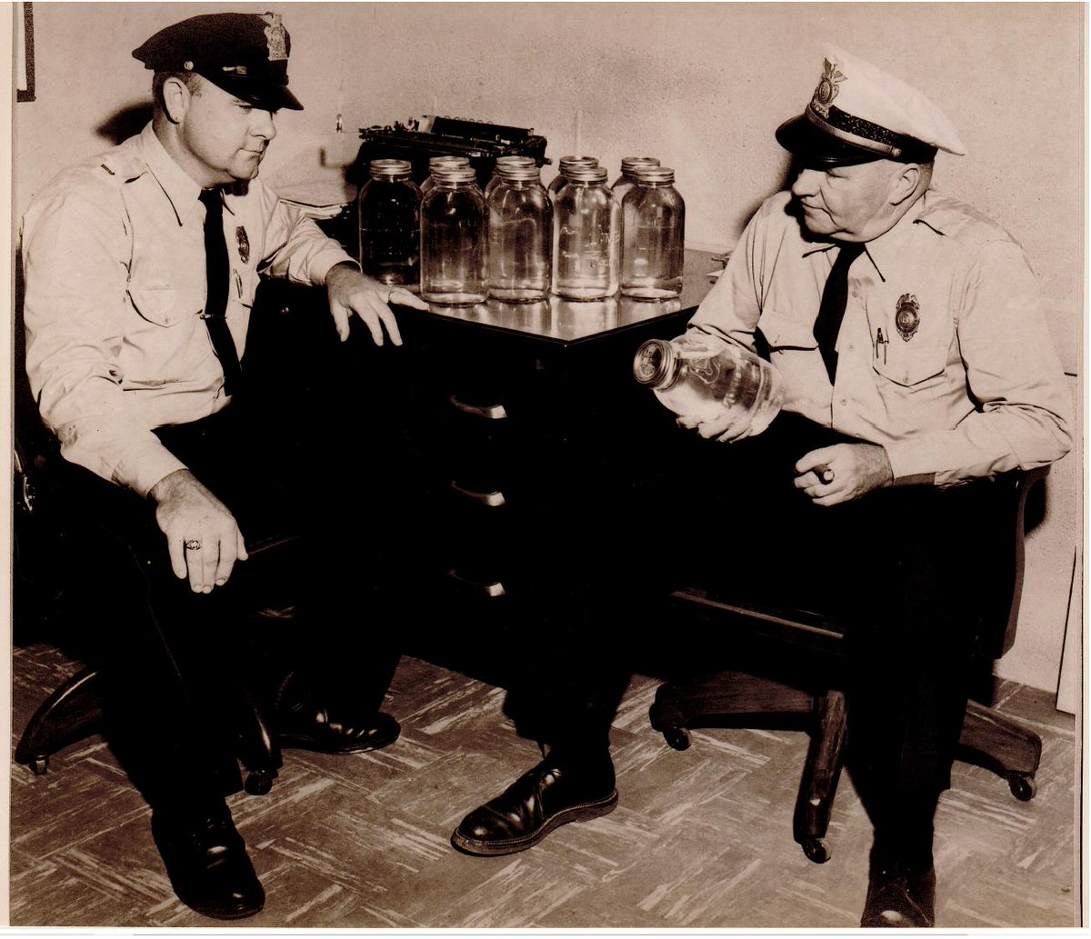#ThrowbackThursday, Grady Stockton (L) and Dewey Sykes (R), having just confiscated a batch of moonshine. Circa 1950's.

Photo courtesy of Will Sykes