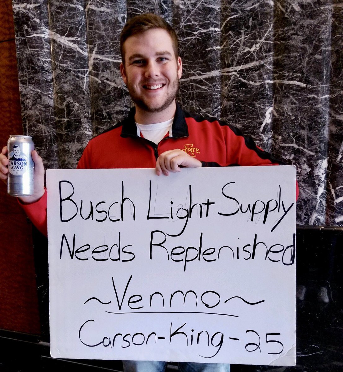 KeithMurphy's tweet photo. As total raised for @UIchildrens reaches $873,000, @CarsonKing2 in NYC-signature @BuschBeer in one hand, sign in other-listens to his beloved #Cyclones via @JWcyclonestv. 📻 

Carson hoping to top one million dollars this weekend. 💰 https://t.co/VPOSclzKZF