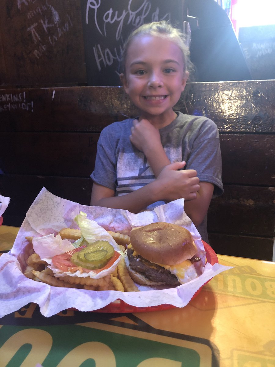 MG_Clark's tweet photo. Her first wang burger @TheWagonWheel  #ProudDadMoment https://t.co/boTj8BNMry