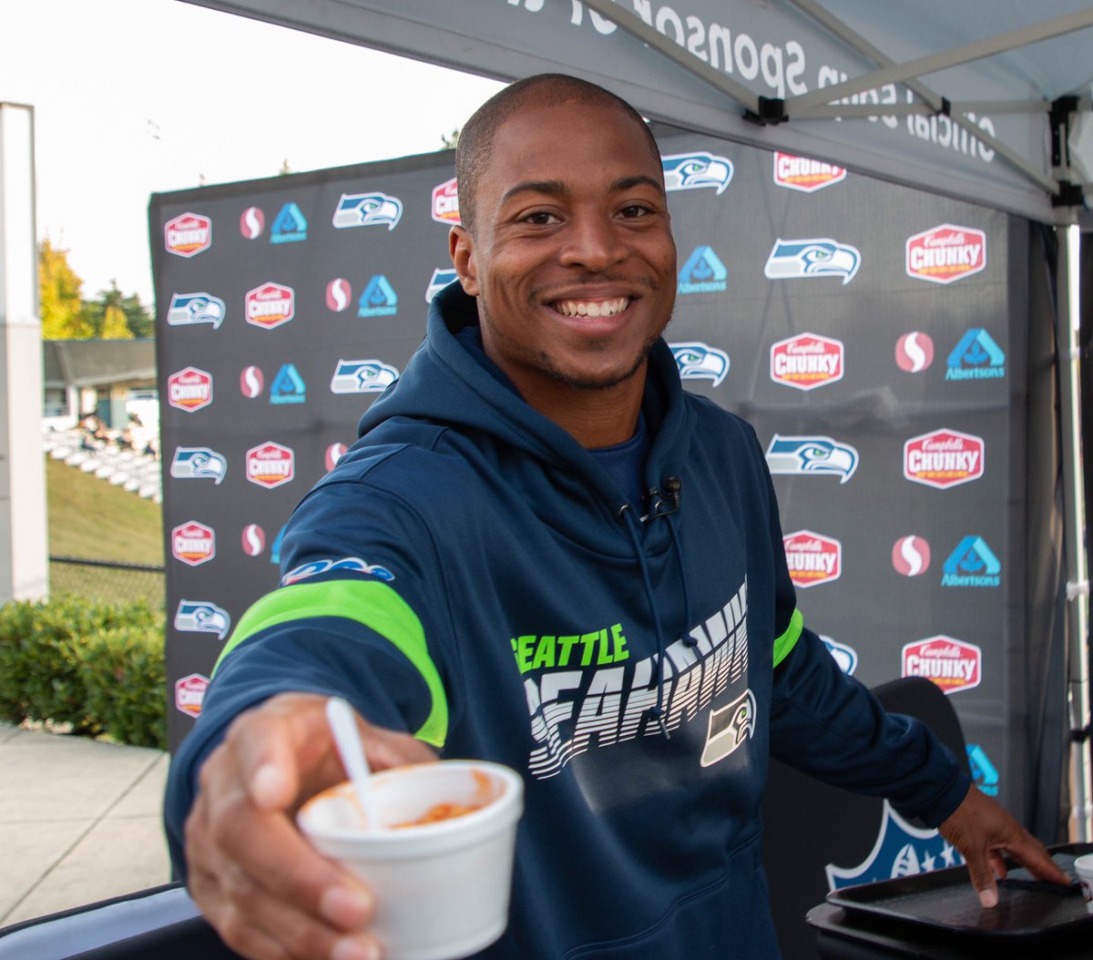 TDLockett12's tweet photo. Lucky to have my biggest fan, my great grandma Meme, with me serving up the 12th Man! Huge shout out to @CampbellsChunky + @Safeway @Albertsons for making tonight possible. #ChampionsofChunky #FuelYourCommunity #SoupSquad #BlueFridayNightLights #GoHawks @Seahawks https://t.co/tfwo9IyfcI