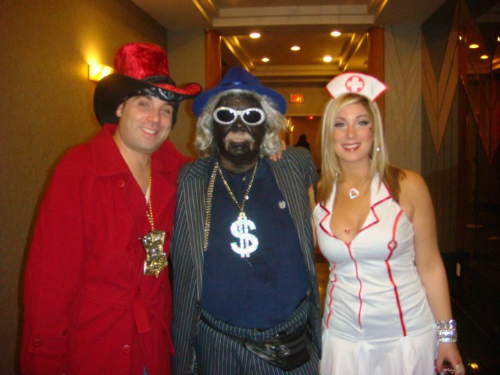 I'm the guy in black face, and I'm no racist. This picture was taken about ten years ago, en route to Laura Fernandez's Halloween party.  It was all in fun and was a great party. This image does not define me, nor does it make a racial statement.