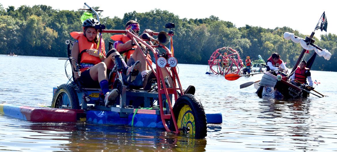 AestheticResear's tweet photo. Picture contraptions that are a mutant hybrid of bicycle, raft, art and comedy. In yesterday's Lowell Kinetic Sculpture Race, they raced through the streets of Lowell, into a mud pit, into the Merrimack River https://t.co/Q5TiLaLrdZ #lowellkinetic #lksr2019 https://t.co/xCcoc5A2R1