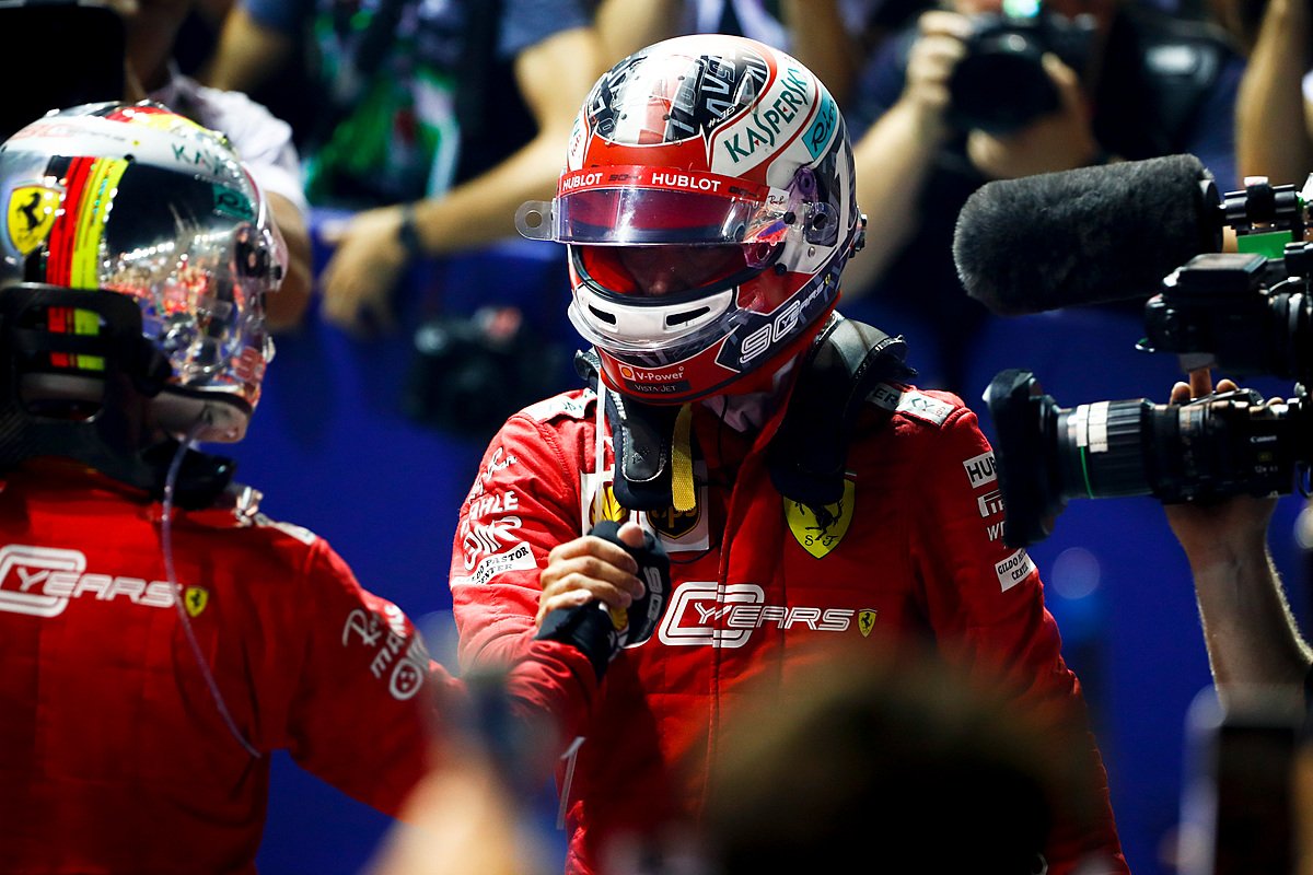 F1NightRace's tweet photo. RESULT: Sebastian Vettel has ended a 22-race drought, winning the #SingaporeGP for a record-fifth time. The German led home teammate @Charles_Leclerc for @ScuderiaFerrari's first one-two result this year. @RedBullRacing's Max Verstappen completed the podium. #F1NightRace https://t.co/XcvzU75mpp