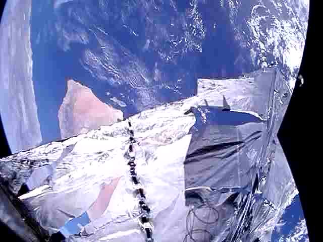 PW-Sat2 is still working correctly after almost 300 days in orbit. This weekend we took another photos. You can see the shadow of the satellite as well as the spring on the deorbit sail.