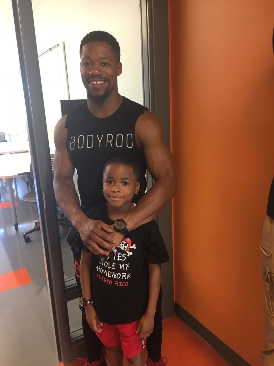 Weaver alumni and his son, Prince , a future Weaver student, tours the school.