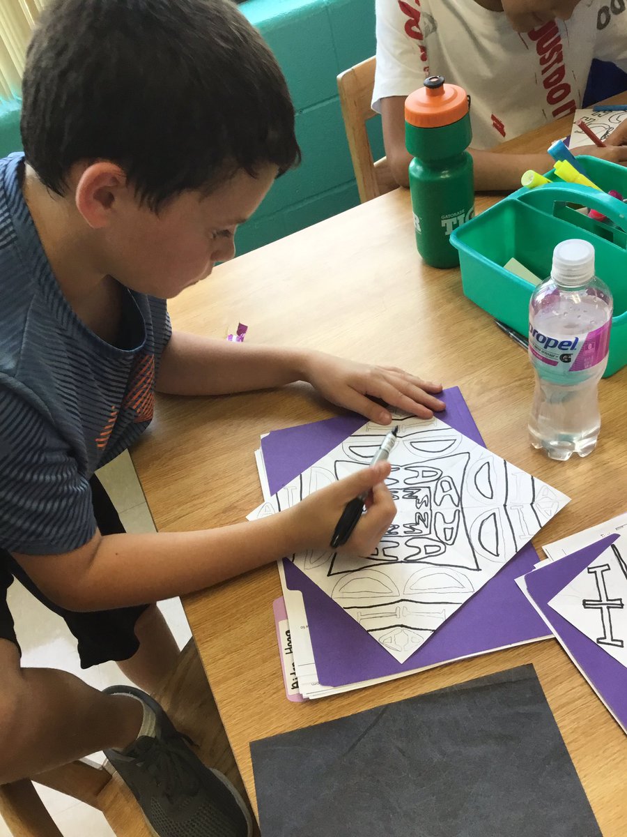 Working with symmetrical patterns creating Islamic tile art in Art class.