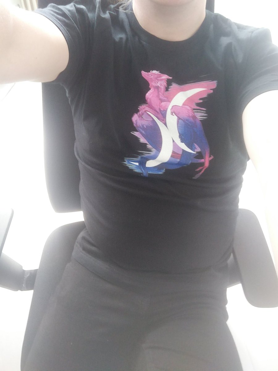 Me wearing a bi pride shirt with illustrations by kaenith