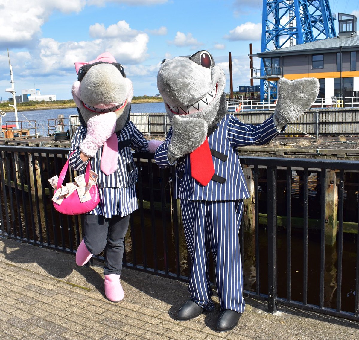 Thirteen_Group's tweet photo. It's #BiteBackWeek! Sid the Shark & Glenda the Lender are up to no good. What's the well-known local landmark behind them? RT this with your guess & you could #WIN a £25 gift card. Closes midnight 27.9.19. 1 winner will be announced next week! Use #spottheshark #stoploansharks https://t.co/jACuw0nGIM