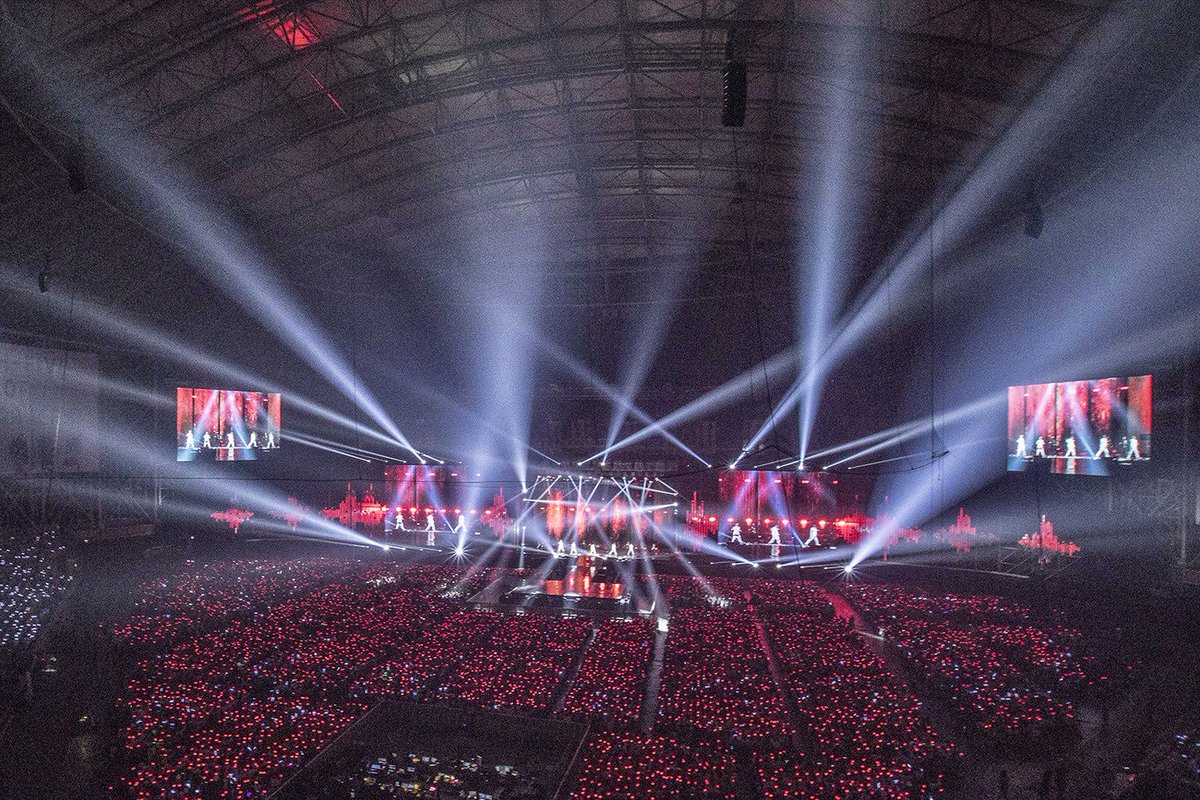 A picture of Gocheok Sky Dome with all the lightsticks lit up in red.