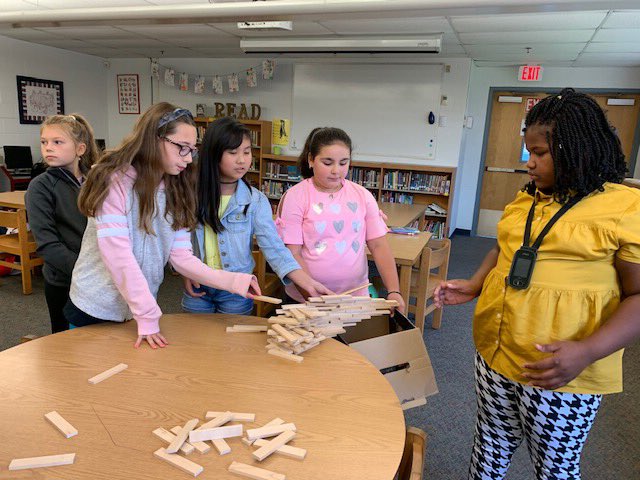 VBMoody's tweet photo. In library, we read the book Rosie Revere, Engineer and then students designed their own hanging structure out of Keva Planks. The longest structure was 12 inches! Awesome engineering, grade 5! (And thank you to Wesley School Librarian Rebecca Deotte for the great idea!) @VBMoody https://t.co/GA06jPECSX