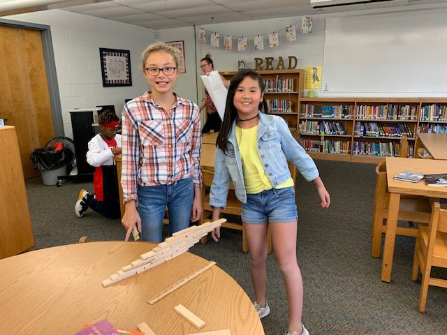 VBMoody's tweet photo. In library, we read the book Rosie Revere, Engineer and then students designed their own hanging structure out of Keva Planks. The longest structure was 12 inches! Awesome engineering, grade 5! (And thank you to Wesley School Librarian Rebecca Deotte for the great idea!) @VBMoody https://t.co/GA06jPECSX