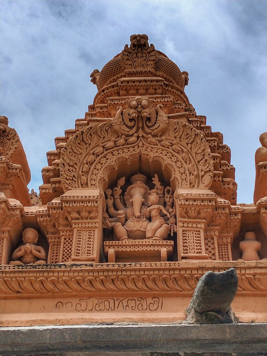 93) Maha Ganapathi. He is the representation of Ganesha as the supreme parabrahman. Shakti seated on his lap is called Pushti (nourishment).He has 10 arms & red in colour.His hands hold a tusk, pomegranate fruit, musala, sugarcane dhanus, chakra, paasa, kamala, paddy & ratnapatra