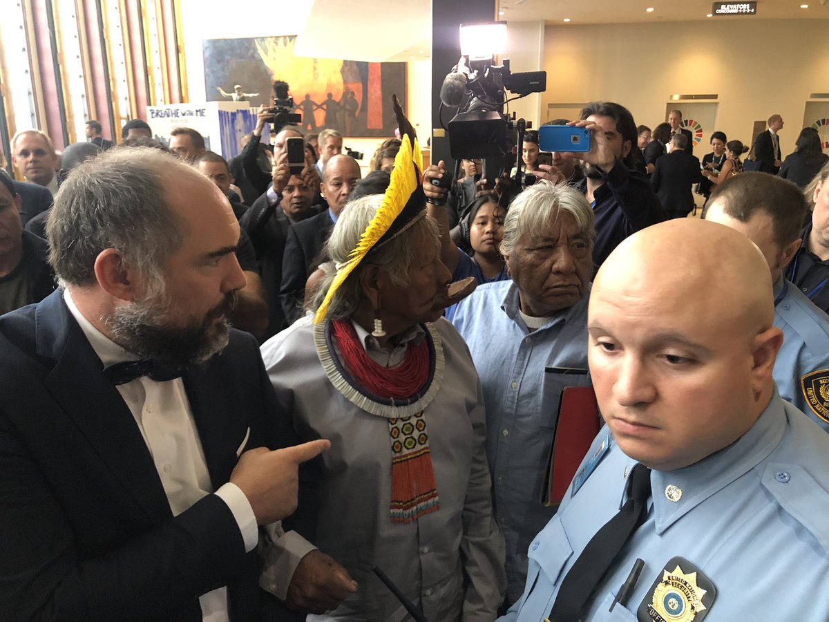 richardgaisford's tweet photo. Bit of a kerfuffle at main entrance to #UNGA #ClimateActionSummit when an Amazonian tribal leader tried to get in. Wanted to address concerns on forest fires and climate change. Didn’t have the right accreditation, was asked to leave. #SoNearSoFar https://t.co/52Yrnl36Ck