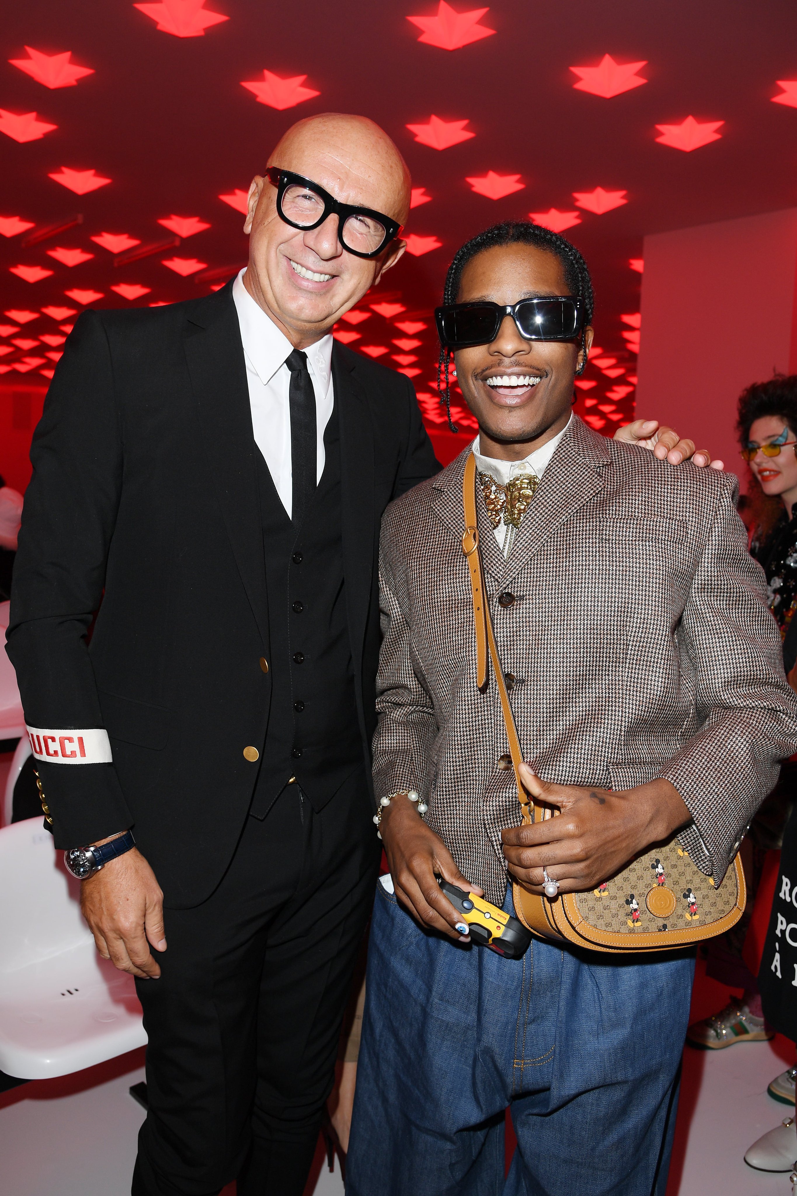 gucci on X: Under the red starred lights before the #GucciSS20 fashion  show, #AsapRocky wearing a Disney X Gucci bag from #GucciCruise20 together  with #MarcoBizzarri CEO and president of #Gucci, #GinevraElkann and #