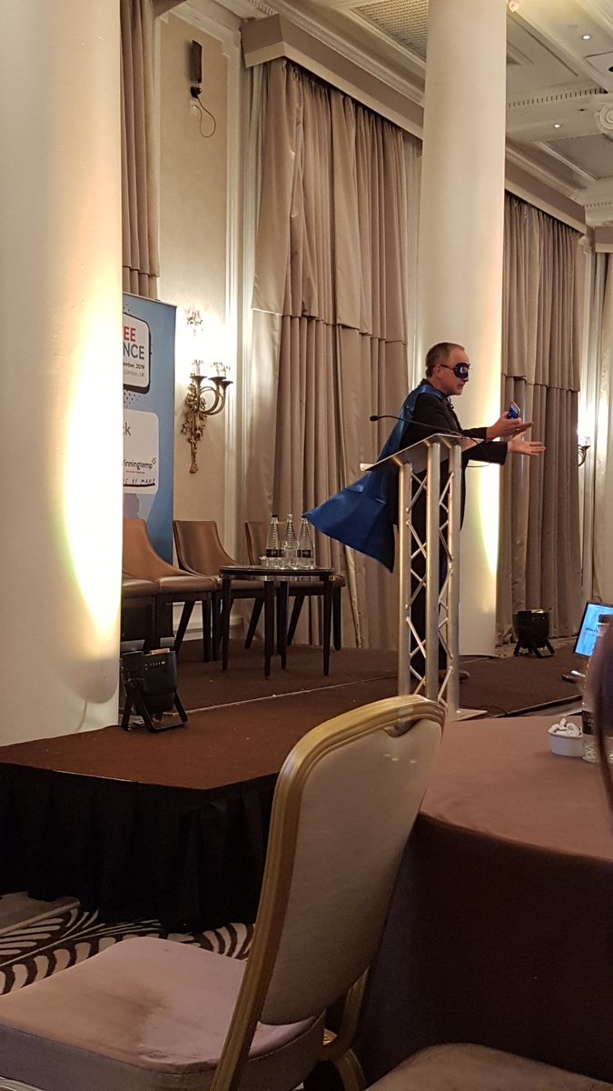Our next speaker is a super hero! Kevin Monroe on the stage. #EmployeeExperience