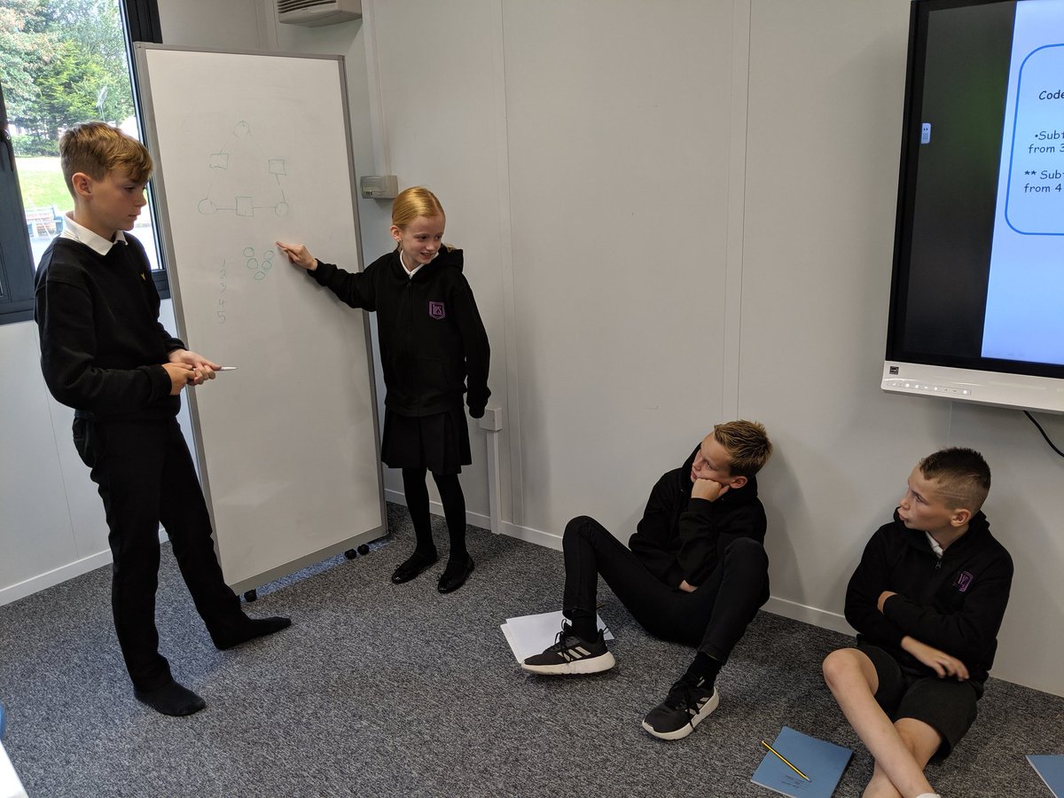 Two of our P7 pupils teaching their peers how to solve arithmagons which they learned at their first Level 3 Maths session @LasswadeHSC ! #LearningLolas #PupilsLeadingLearning