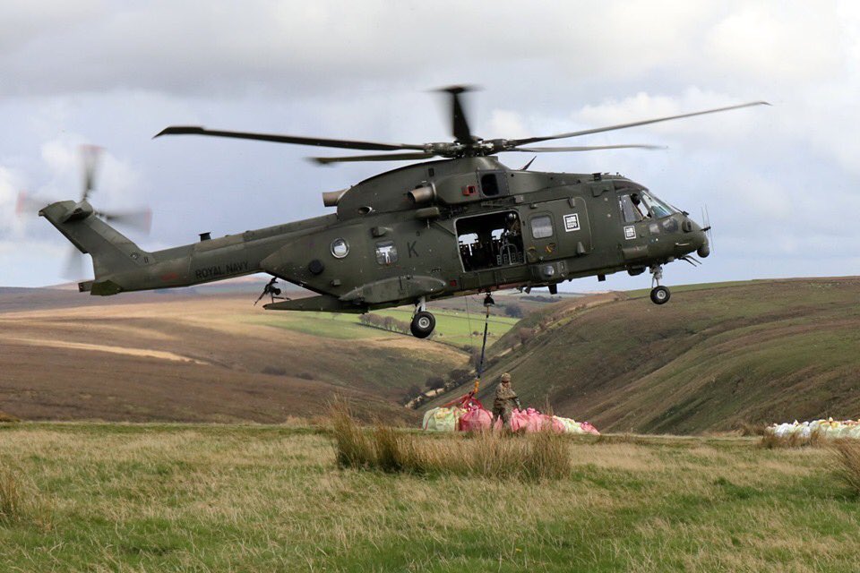 RNASYeovilton's tweet photo. @846NAS & #MAOT (Mobile Air Operations Team) seen here a few days ago undertaking a live lift of stone to repair parts of the #TarkaTrail called the Chains @ExmoorNP
The #MightyMerlin doing what it does best @co_chf and 💪🏻🚁⚓️
#FlyNavy https://t.co/tdNJzDkhk5