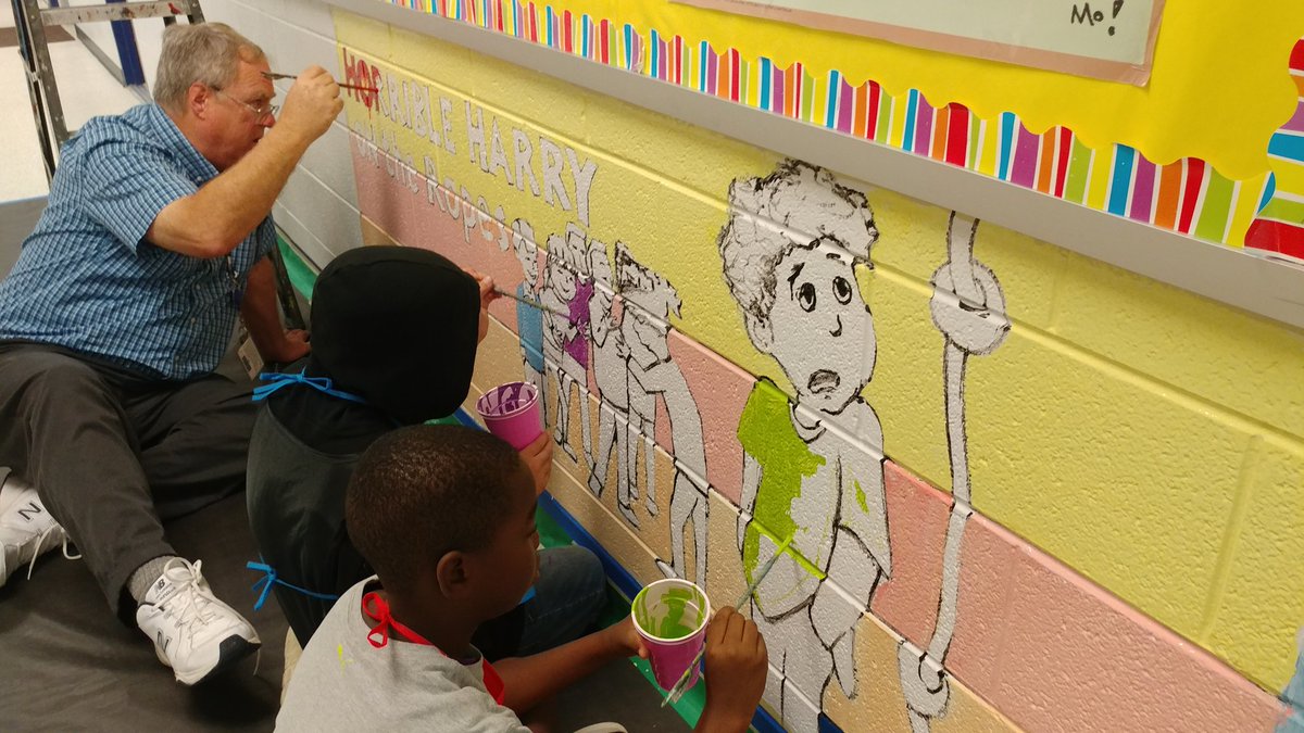 Mr. Settle's team is helping to beautify @LakeRidgeES by painting storybook characters on the library wall. #LRESPride