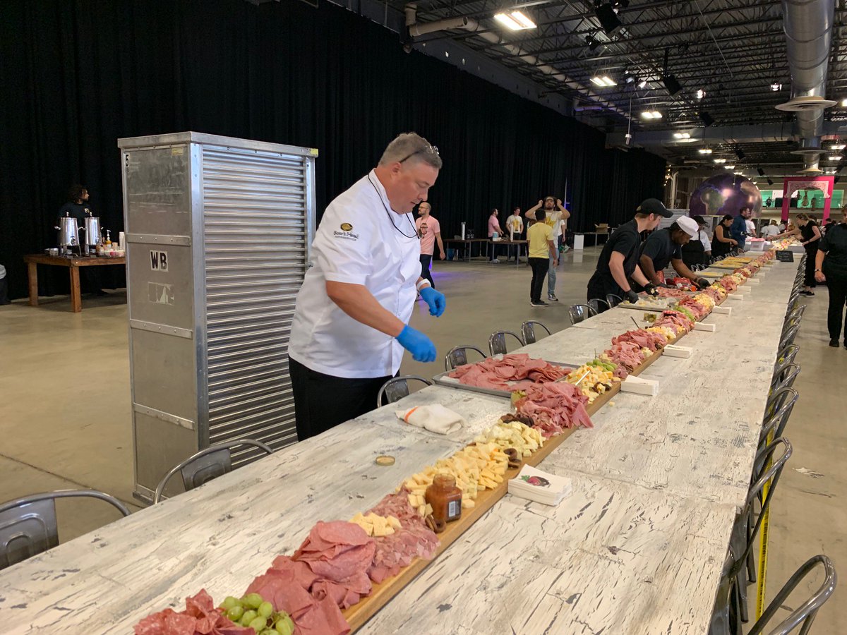 GWR's tweet photo. New record: @Datassential has just smashed the record for the largest charcuterie board with a spread that measured 150.5 ft (45.73m) long!
Smothered it with over 400 lb of meat, cheese, and other foods it looks nothing short of delicious😍🧀🍖🍇 https://t.co/bpHKVO4XFh
