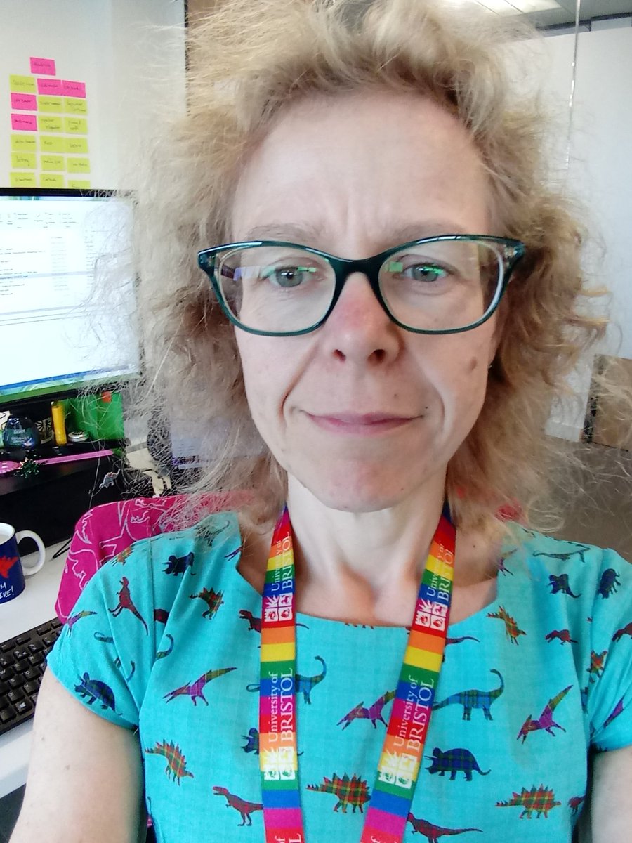 ceiswyn's tweet photo. Can you find all the dinosaur-themed items in this photograph of a not-palaeobiologist? https://t.co/8DcwZEruhX