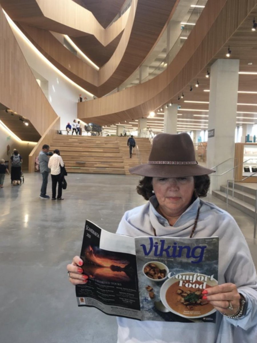 SonsofNorway's tweet photo. With the Viking magazine in hand, Sons of Norway member Lizabeth Halva visits the Calgary Library in Canada. Help us start a trend by sharing where YOU have taken your Viking magazine! Post your image and hashtag #VikingMagazine and we'll share the image on our social pages! https://t.co/EKLGW5qY3u
