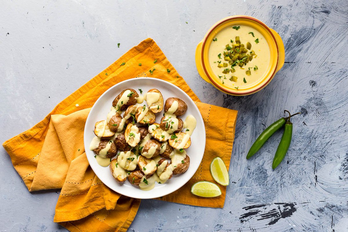 New recipe! Roasted <a href="/LittlePotatoCo/">Little Potato Co.</a> Creamer potatoes served with a rich and cheesy jalapeño vegan “queso”. #AD Get the recipe → ilovevegan.com/vegan-queso-po…