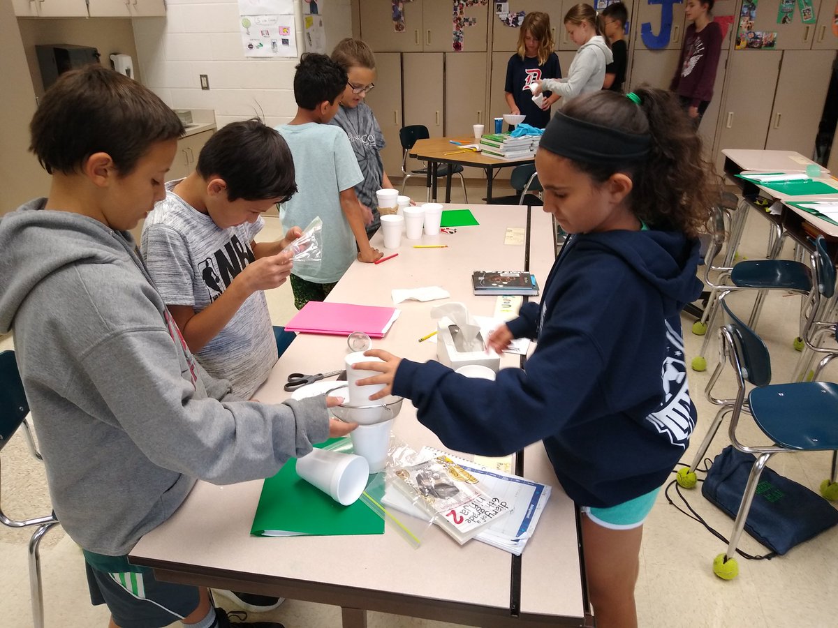Don't muddy the water! Students attempting to build the perfect mechanical filtering system! Results to follow!