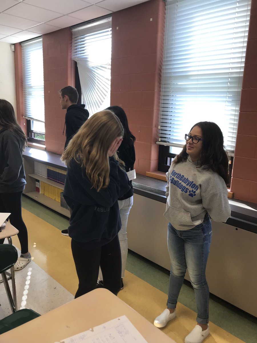 8th grade Italian students use the adjectives they're reviewing to ask questions of their classmates and try to find out who is the mystery character taped on their backs! 😊