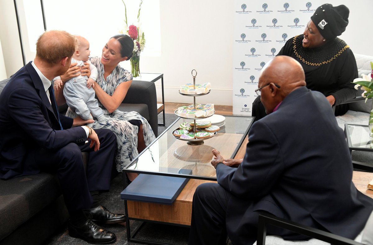elliotwagland's tweet photo. Prince Harry and his wife Meghan, Duchess of Sussex, holding their son Archie, meet Archbishop Desmond Tutu and his daughter Thandeka at the Desmond &amp; Leah Tutu Legacy Foundation in Cape Town, South Africa.

📷  @Reuters https://t.co/TBs3MZPANs
