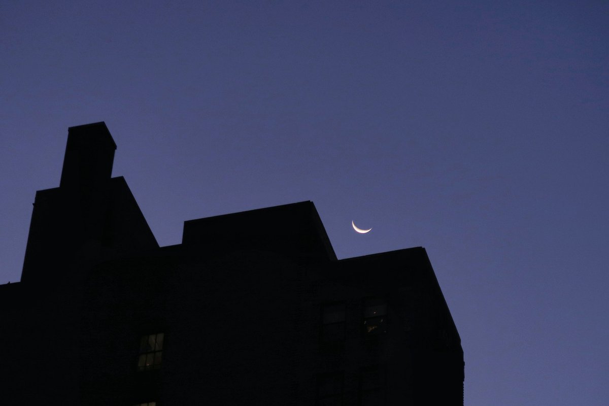 Crescent moonrise over 6th Avenue as the sun rises in New York City this morning. #newyorkcity #nyc #newyork #moon @agreatbigcity