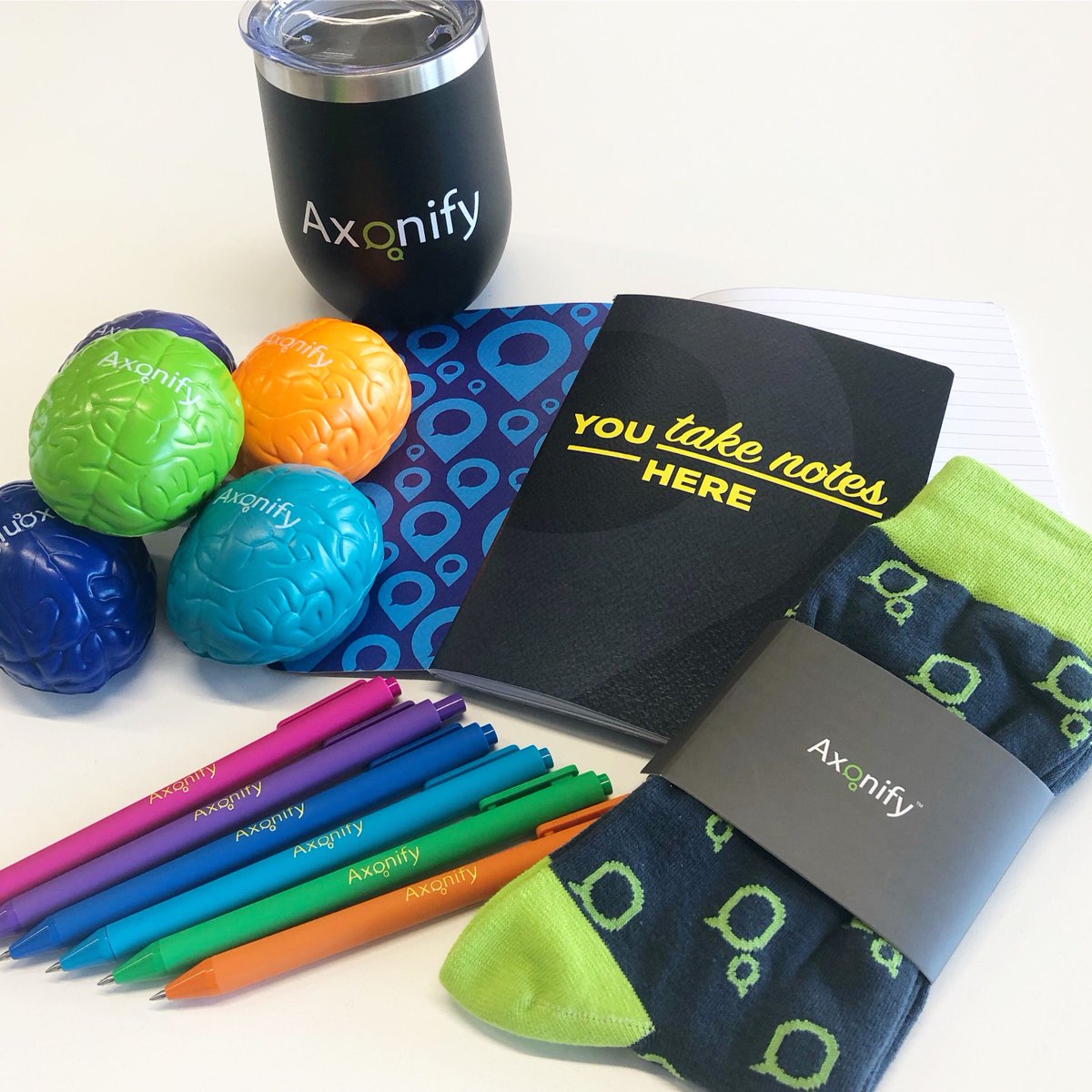 Axonify's tweet photo. Everyone always looks forward to conference swag, and the team has been hard at work to bring our most loved pieces back and some new surprises. What will be your fave this year? #AxonCC #swagbucks https://t.co/ARgWTZSSRn