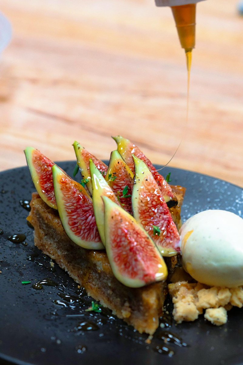 In season and delicious - our Almond Tart with marzipan, fresh figs, cracked pepper, thyme, honey and vanilla gelato might just be your new favorite treat! #Dessert #UniqueDishes #FigSeason #SantuariLA
