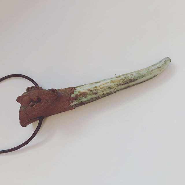 Copper plated antler tip pendant with miniature wolf skull. A real antler tip (nature found naturally shed antler) from a scottish red stag, with a miniature anatomically correct wolf skull, with the top electro played with copper, suspended on a vegan leather necklace. One of a