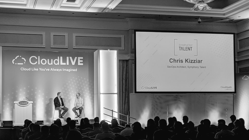 VMW_CloudHealth's tweet photo. Jason Needham invites @chriskizziar to the stage to talk about @SymphonyTalent_'s #cloud #security journey.

They use VMware Secure State to mitigate risks and "keep out of the news." https://t.co/DNJxQjJ1Go