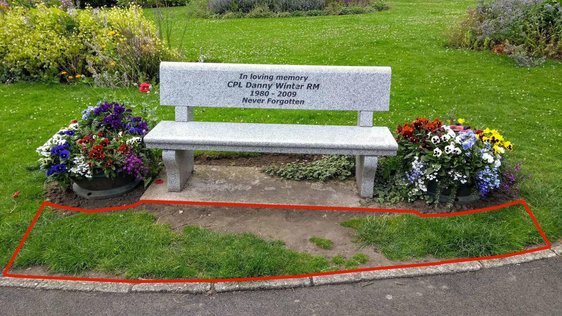 The wear and tear in front of Danny's bench